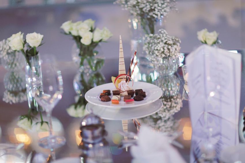 Mini desserts display with white roses and baby's breath