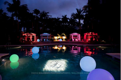 Brightly lit and multi-hued outdoor reception at The Ritz Carlton Naples