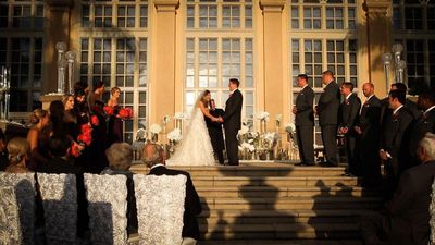 The couple sharing their vows at The Ritz Carlton Naples 