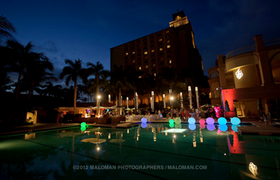 Brightly lit and multi-hued outdoor reception at The Ritz Carlton Naples