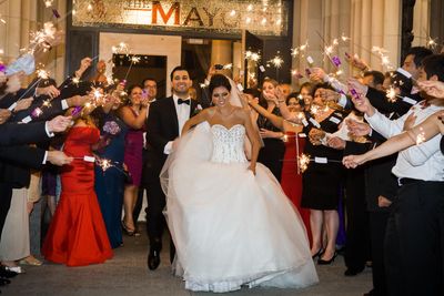 The couple leave their reception at The Mayo Hotel under sparklers