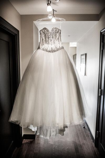 The bride's strapless Casablanca Bridal wedding gown on display