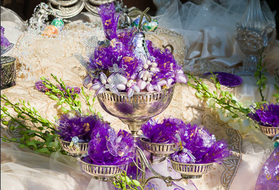 Walnuts, noghl and gold coin party favors for ceremony guests