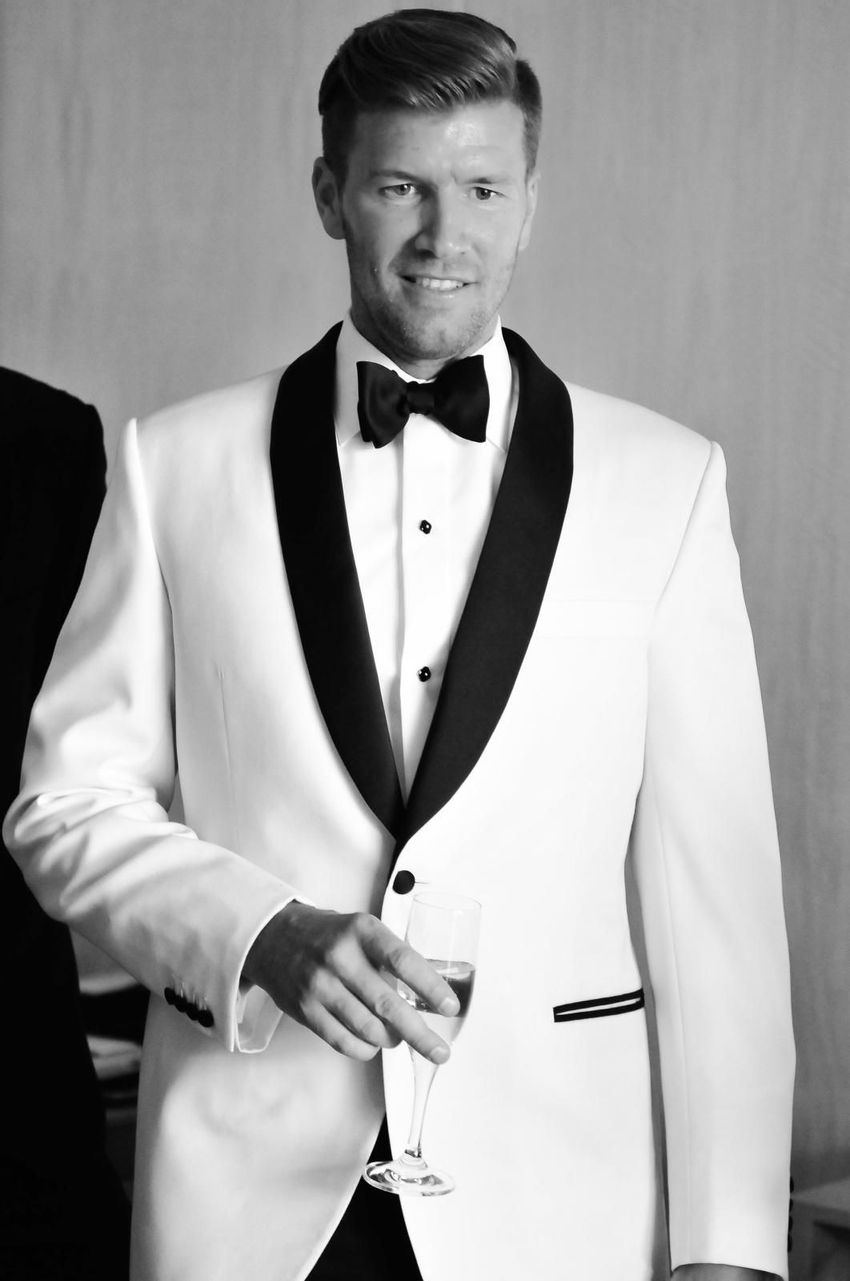 Groom drinking champagne prior his ceremony 