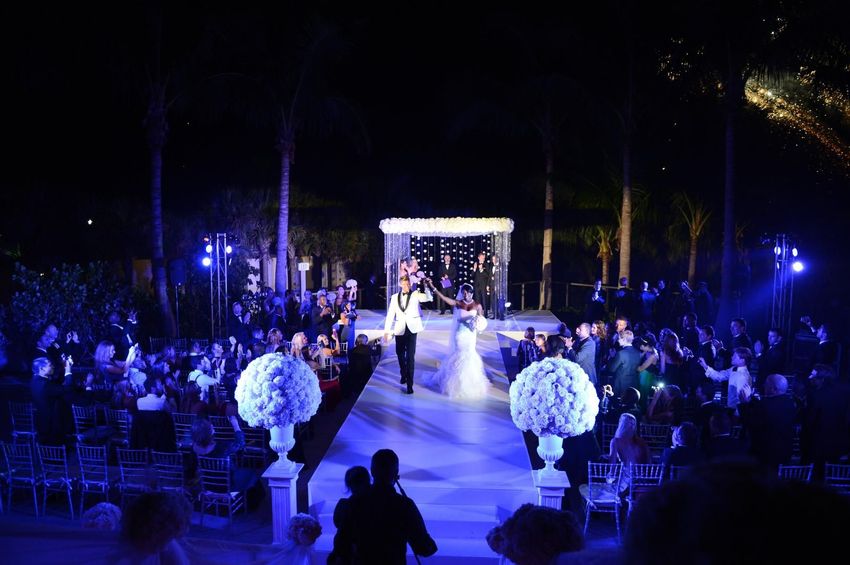 Newly married couple right after their ceremony at The St. Regis Resort, Bal Harbour
