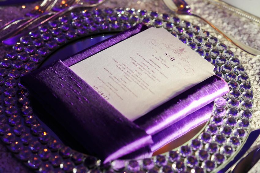 Purple hue dinner table with dinner menu