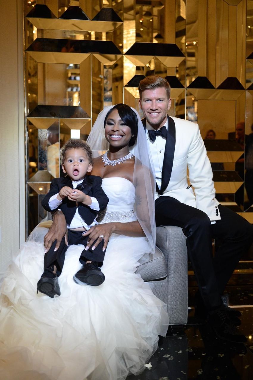 The couple during photoshoot with their ring bearer 