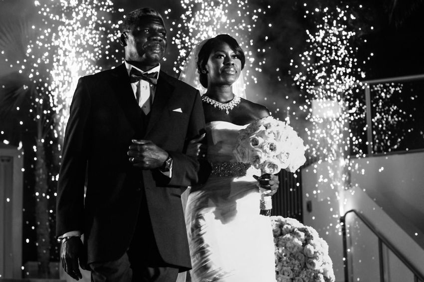 Bride in her Vera Wang wedding gown and her father entrance while fireworks starts