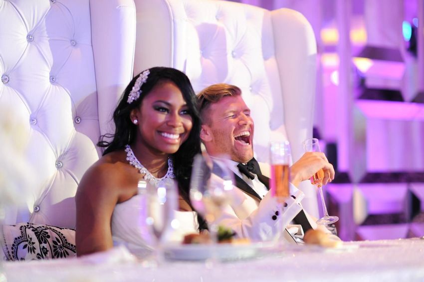 Couples at their sweetheart table enjoying their guest speeches